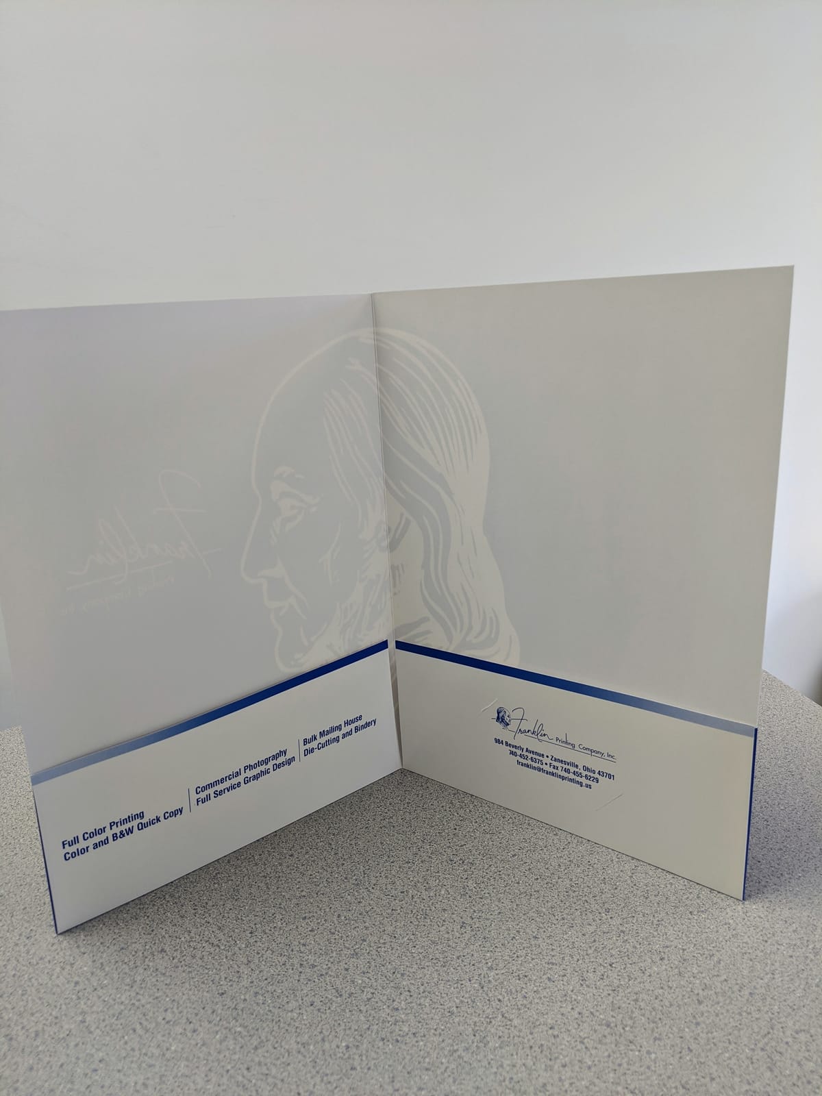 Inside of a Franklin Printing presentation folder showing service pockets